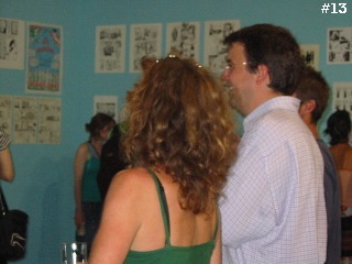 People viewing artwork in the gallery area.